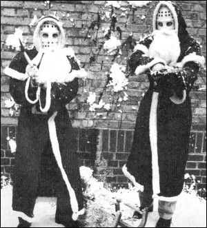 Two Santa Claus with ski masks ...